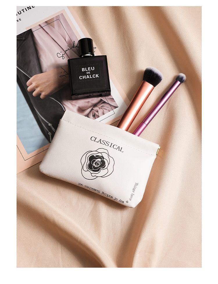 Camellia storage bag with automatic closure, wired earphones, portable bag, power charger, mini portable digital bag